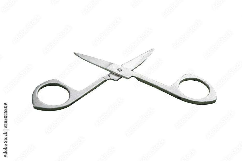 Hand care tool - small shiny stainless steel manicure scissors, isolated on white background, close, short focus Hand care tool - small shiny stainless steel manicure scissors, isolated on white background, close, short focus