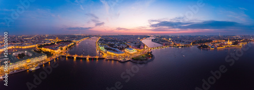 Beautiful aerial evning view in the white nights of St. Petersburg, Russia, The Vasilievskiy Island at sunset, Rostral Columns, Admiralty, Palace Bridge, Stock Exchange Building. shot from drone. photo