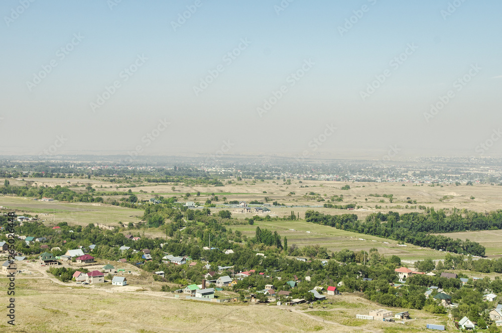 Fototapeta premium Numerous villages and private houses near the city of Almaty in Kazakhstan. Photographed from a bird's-eye view.