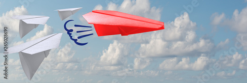 A group of white paper air planes heading in one direction and one red individual pointing in the different way as a business industry icon for innovative solution.