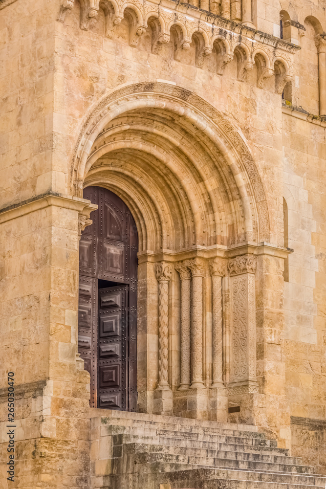 Detailed view of frontal gate of the gothic building of Coimbra Cathedral