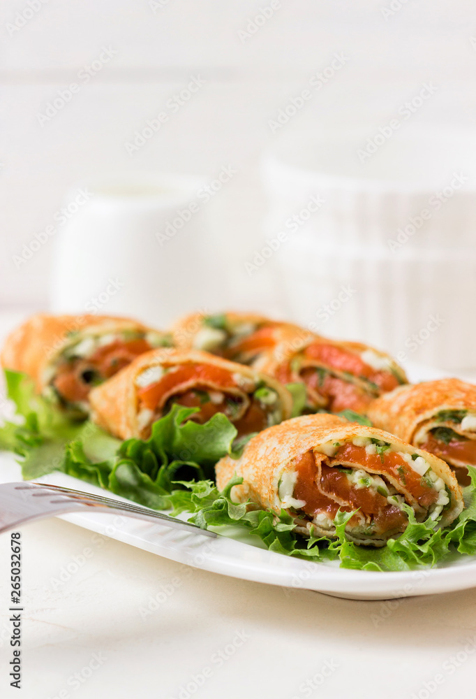 Fresh rolls with cheese, red fish and salad.