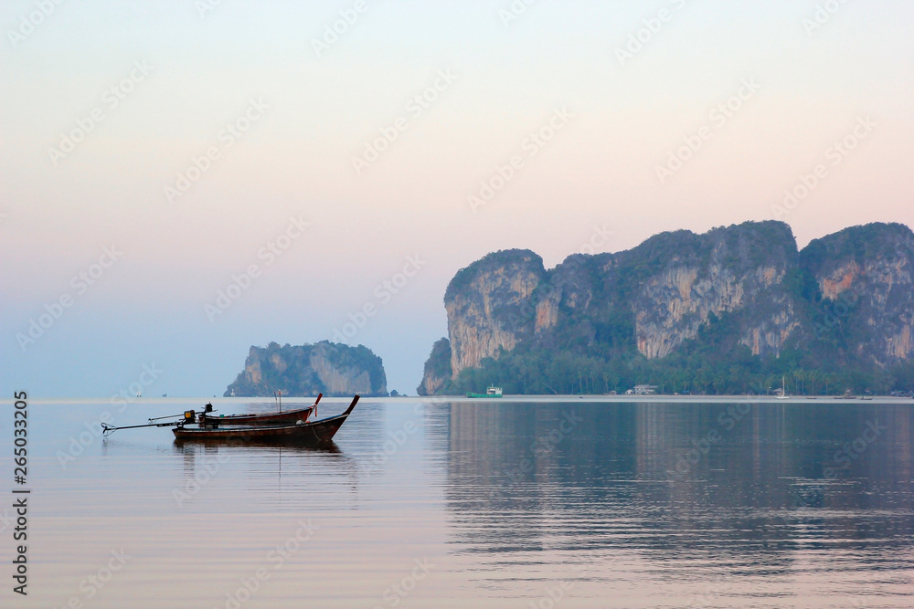 fishing boat in the sea with beautiful sky background