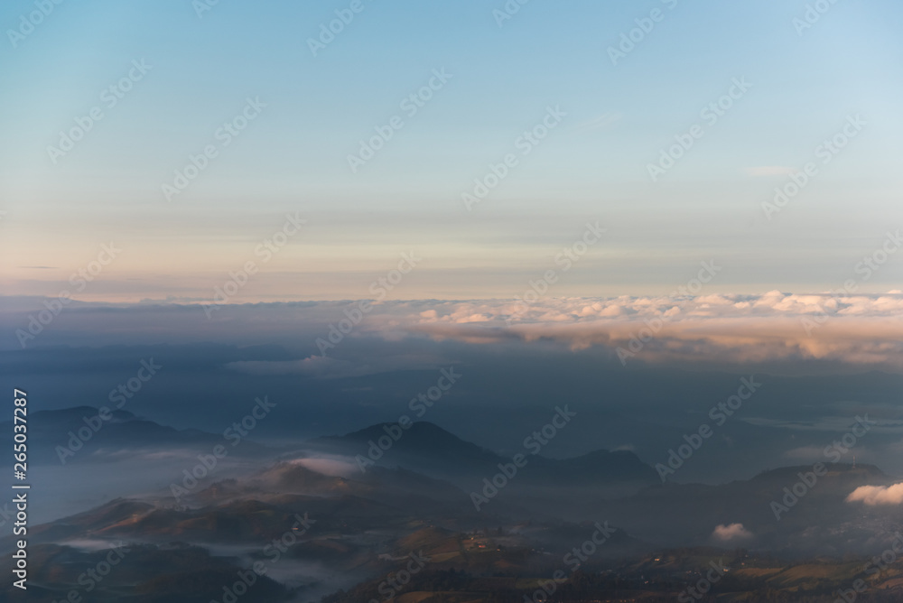 Dawn between fog in mountain ranges of the Colombian Andes