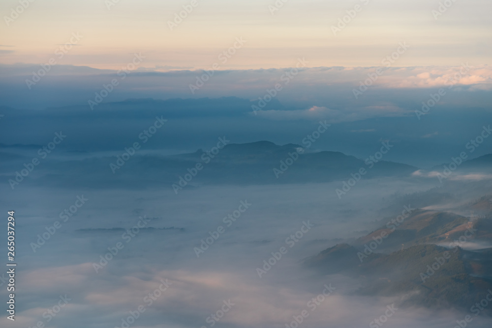 Dawn between fog in mountain ranges of the Colombian Andes