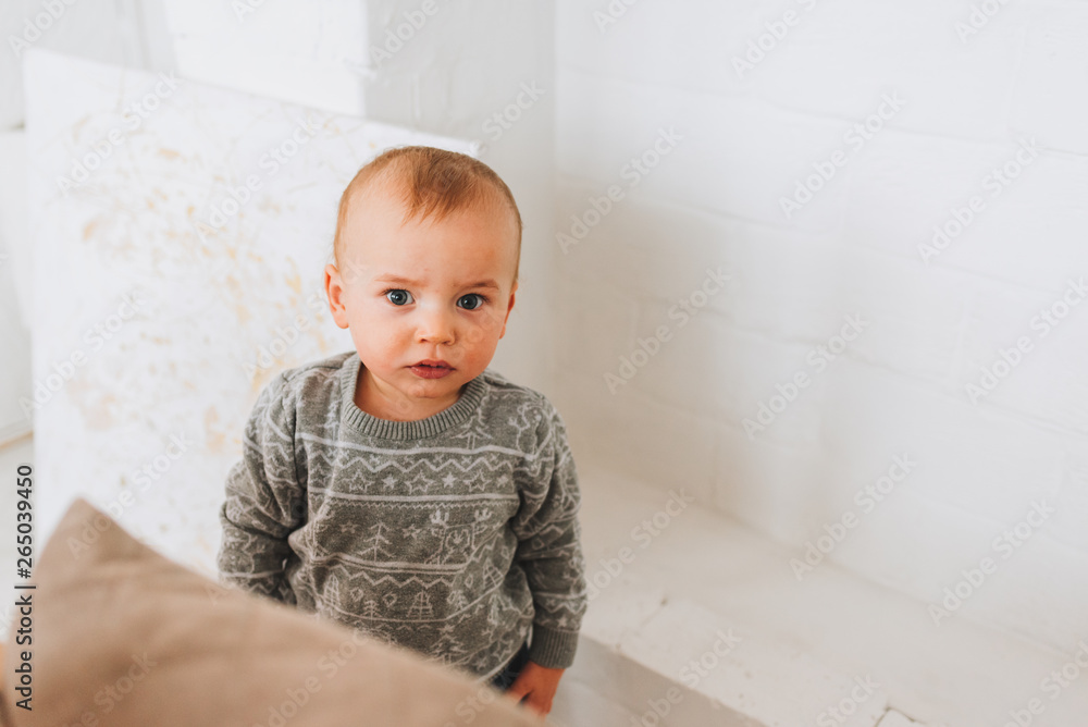 Cute little toddler boy looking straight into the camera Cute little toddler boy looking straight into the camera