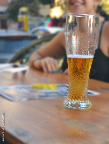 glass of beer on wooden table