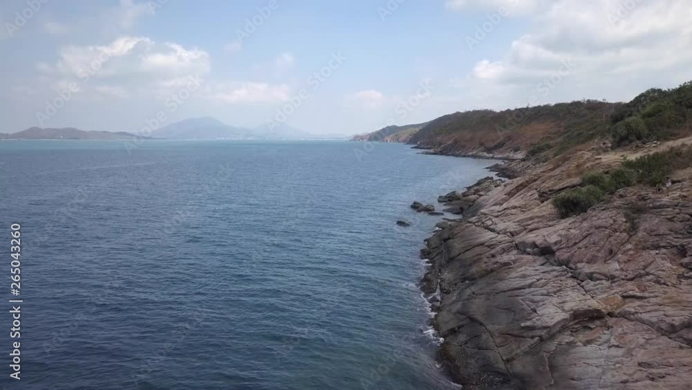 Aerial flying at low altitude over a shore of rocks and water vacation landscape in the Samet Island, Thailand. Drone dolly in forward. Aerial flying at low altitude over a shore of rocks and water vacation landscape in the Samet Island, Thailand. Drone dolly in forward.