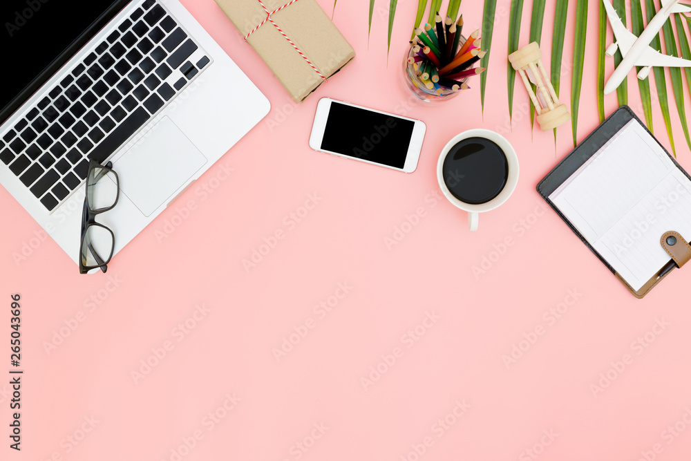 Flat lay office workspace with blank laptop, clipboard, top view laptop