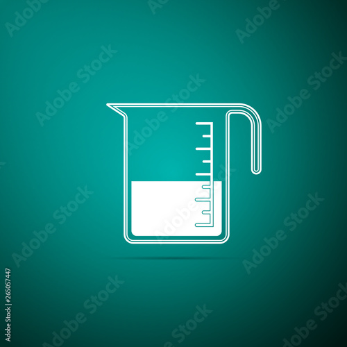 Measuring cup to measure dry and liquid food icon isolated on green background. Plastic graduated beaker with handle. Vector Illustration