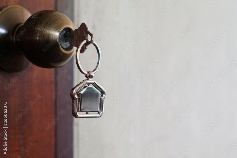 House key with home keyring in keyhole