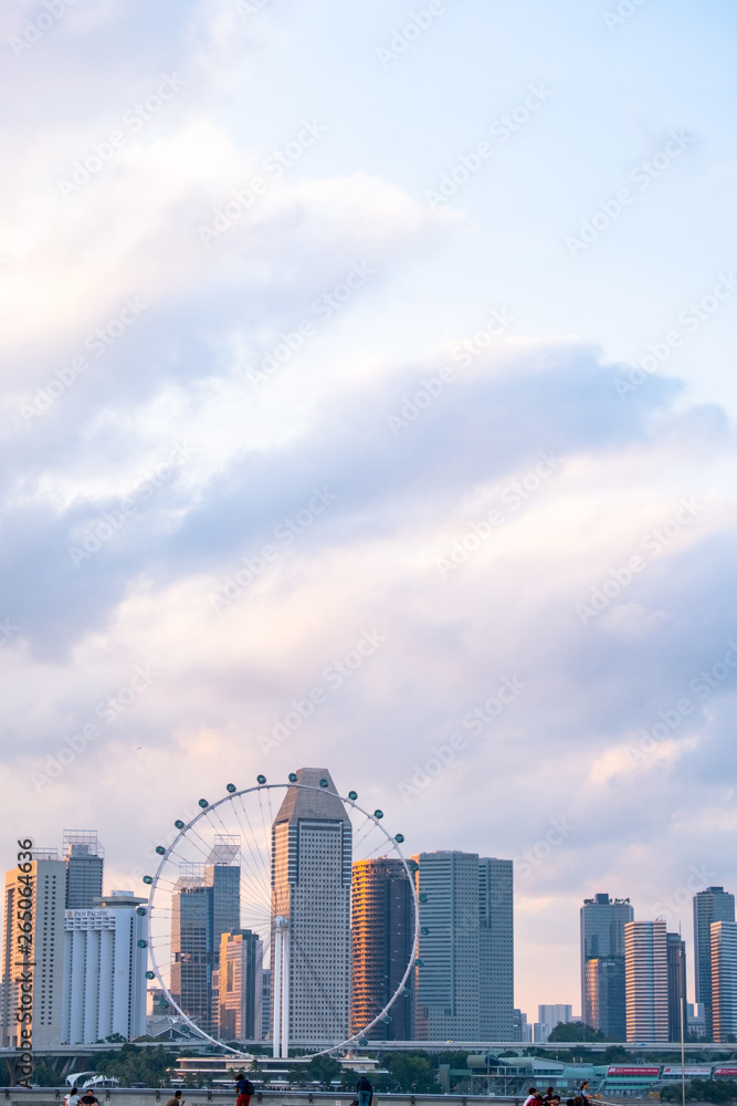 2019 March 1st, Singapore, Marina Barrage - View of the Flyer and buildings at sunset. 2019 March 1st, Singapore, Marina Barrage - View of the Flyer and buildings at sunset.