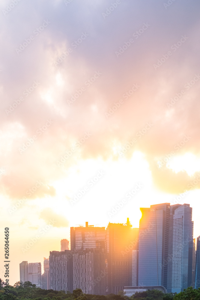 2019 March 1st, Singapore, Marina Barrage - View of the buildings at sunset with golden light through the clouds.