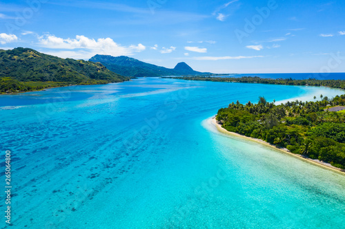 Aerial drone view of French Polynesia Tahiti island Huahine and Motu coral reef lagoon and Pacific Ocean. Tropical paradise. photo
