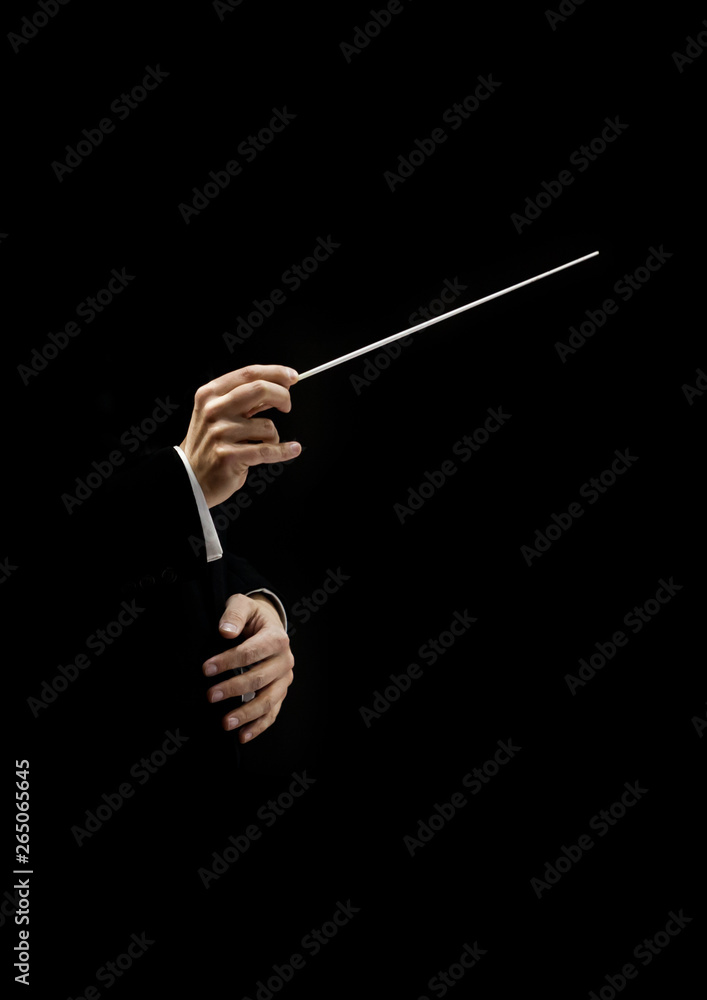 Hands of conductor on a black background Hands of conductor on a black background