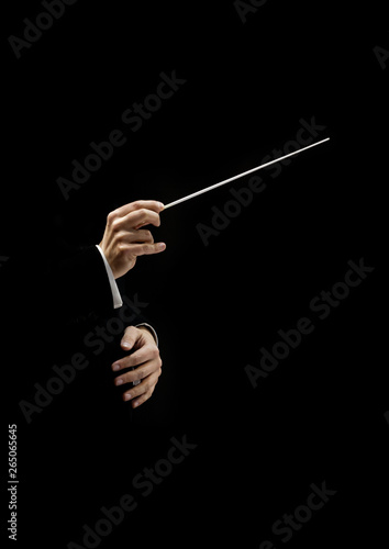 Hands of conductor on a black background