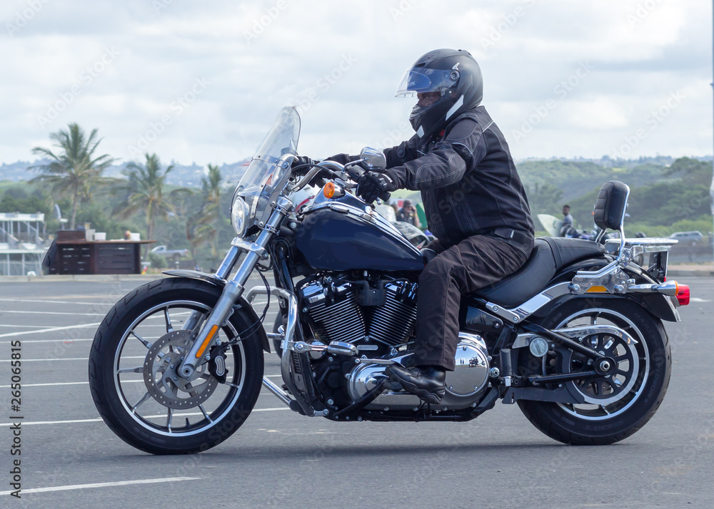 african man riding a large motorcycle