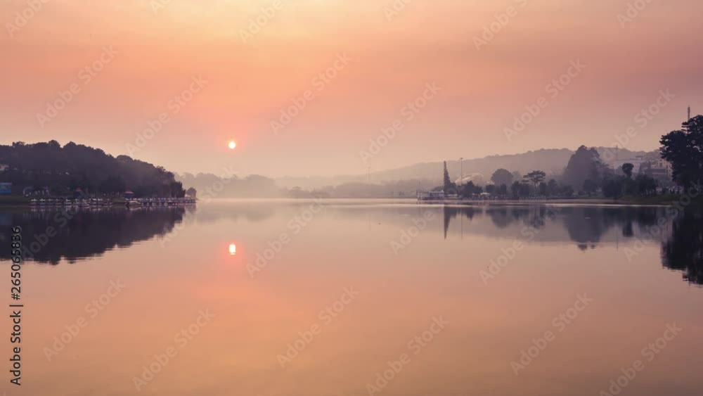 Beautiful view of sunrise over Xuan Huong Lake, Dalat, Vietnam. Amazing landscape at sunrise time Beautiful view of sunrise over Xuan Huong Lake, Dalat, Vietnam. Amazing landscape at sunrise time