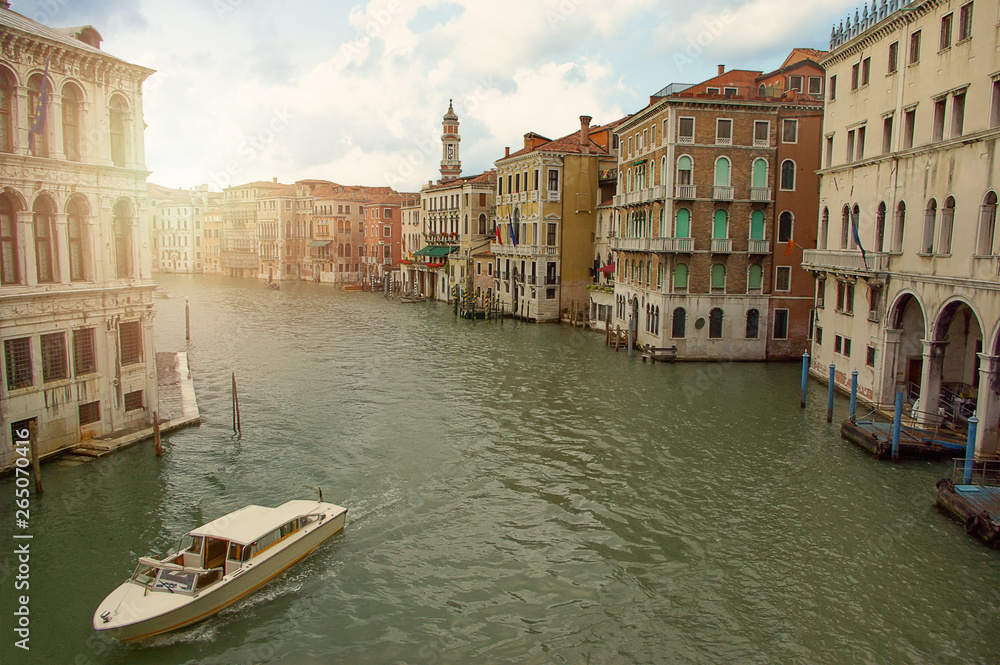 Boats in big canal waters of Venice Italy. Street in water city