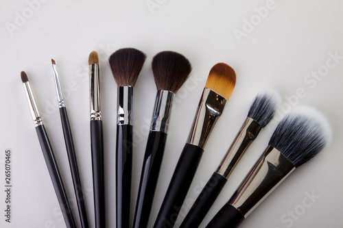 Brushes for make-up, make-up tools. Make-up artist. Brushes laid on the table. view from above. Usage: Advertisement, poster, brochure, sticker. top view