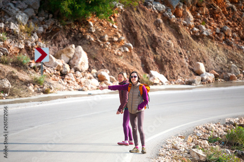 Hitchhiking on a mountain road. photo