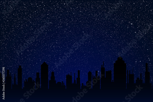 City on the starry night sky with dark blue glow.