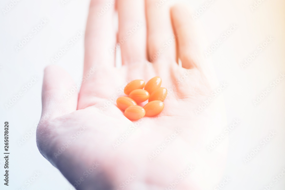 hand with pills on white background. pills in the palm. hand with pills on white background. pills in the palm.