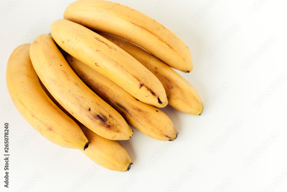 Fresh ripe Bananas on white background, vegetarian concept.