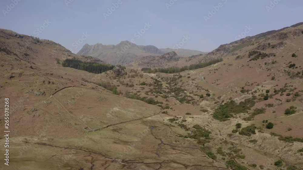 Drone forward flyby with slow camera tilt reveal in The Lake District, Cumbria Drone forward flyby with slow camera tilt reveal in The Lake District, Cumbria