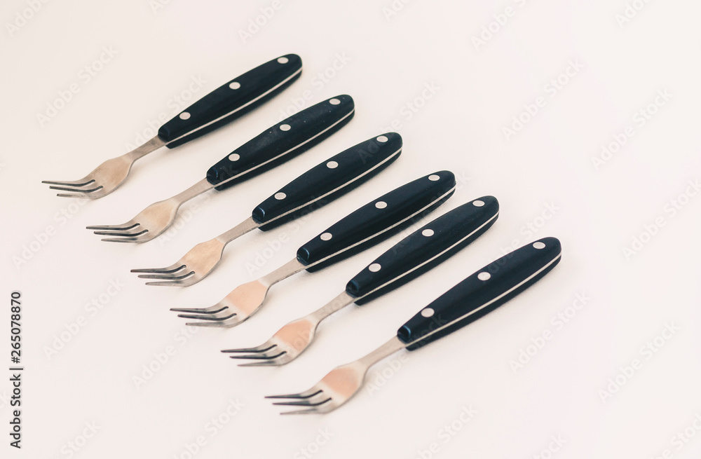 Close up six forks isolated on white background. Close up six forks isolated on white background.