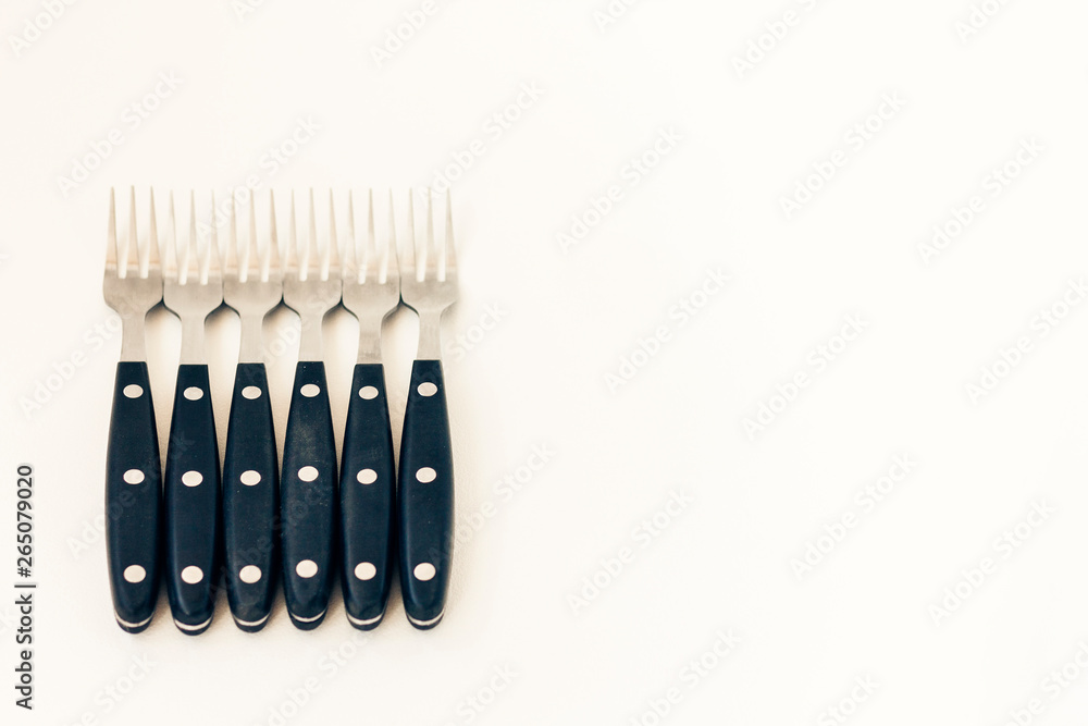 Close up six forks isolated on white background. Close up six forks isolated on white background.