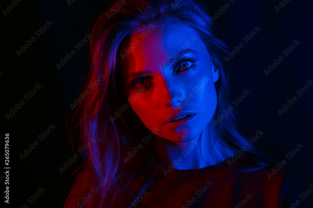 Portrait of a beautiful girl in two colors.