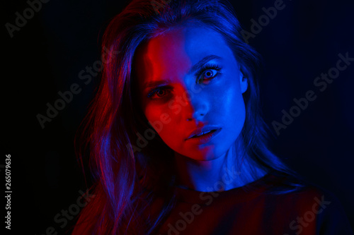 Portrait of a beautiful girl in two colors.