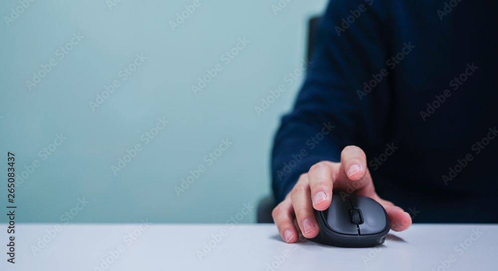close up employee man hand using mouse cursor for scrolling web page or  working on computer program at desktop in office concept Stock 写真 | Adobe  Stock