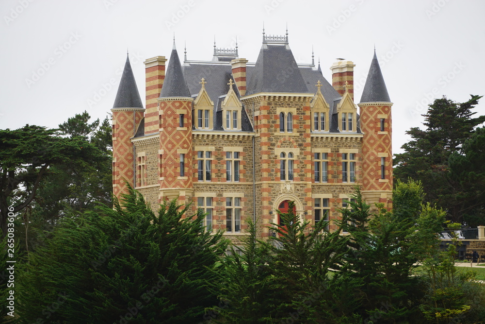 old brick and stone castle in Brittany, France by the harbor