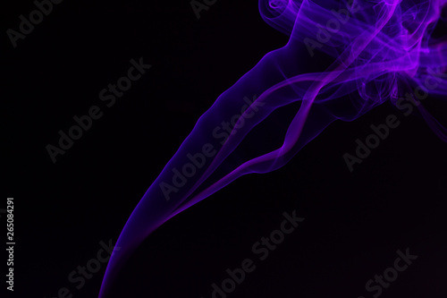 Fototapeta Naklejka Na Ścianę i Meble -  Colorful smoke close-up on a black background