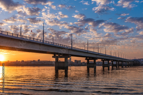 Bridge over the river at sunset - a beautiful evening landscape, Saratov Bridge across the Volga.
