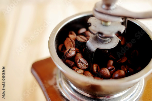 vintage Coffee grinder on wood table.
