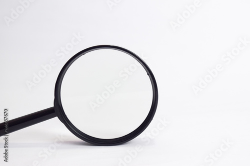 Close up Magnifying glass loupe isolated on white background
