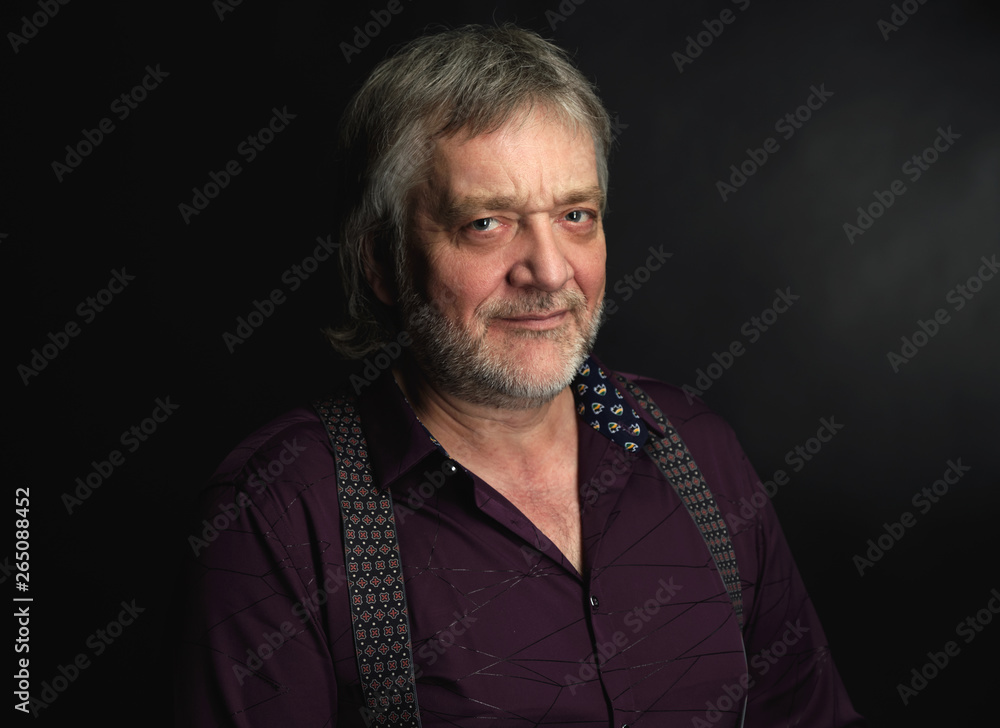 Obraz premium Portrait of old handsome bearded man is smiling.