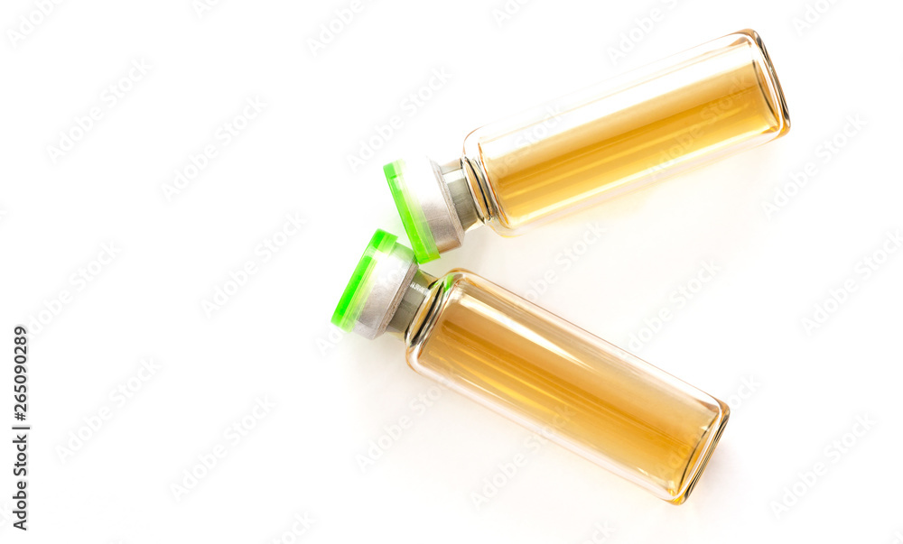 Cosmetic injections bottle - botox, filler, collagen and hyaluronic acid solution. Injection cosmetology. Healthcare, medical, pharmaceutical and beauty concept. Closeup with soft selective focus Cosmetic injections bottle - botox, filler, collagen and hyaluronic acid solution. Injection cosmetology. Healthcare, medical, pharmaceutical and beauty concept. Closeup with soft selective focus