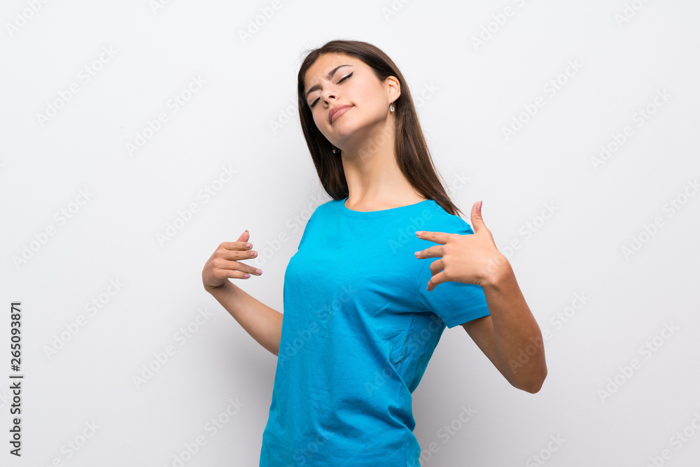 Teenager girl with blue shirt proud and self-satisfied Teenager girl with blue shirt proud and self-satisfied
