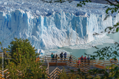 Tourists in walkways looking at Perito Moreno Glacier and Lago Argentino in El Calafate, Argentina