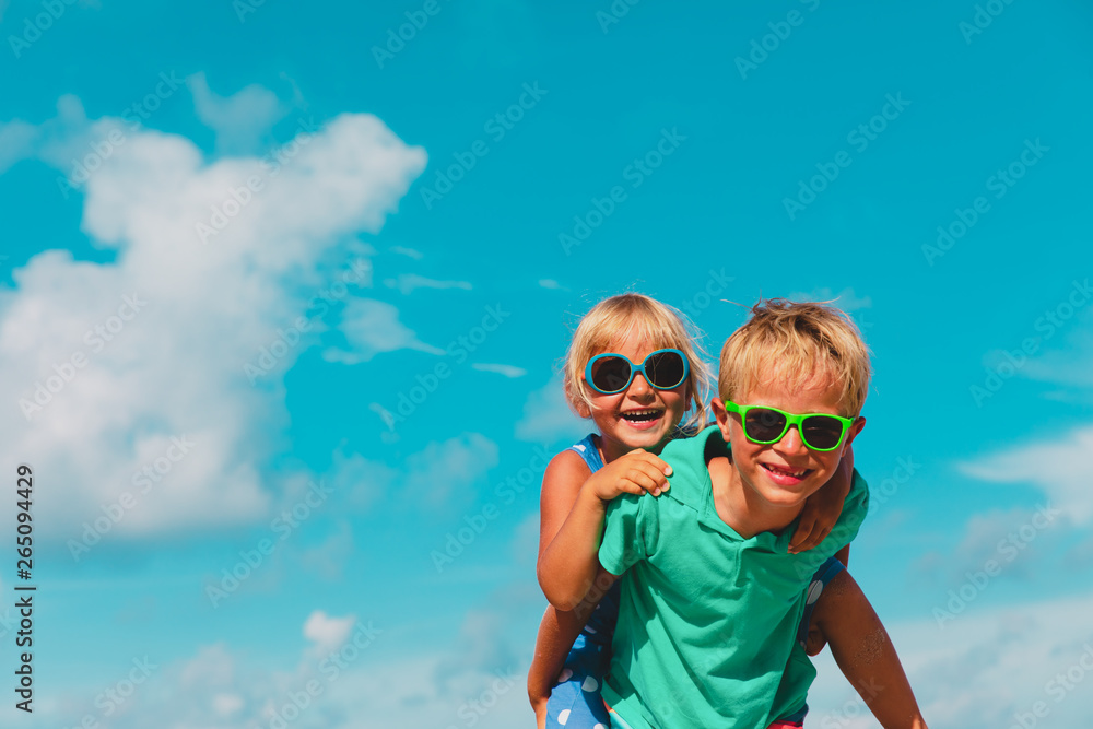 happy cute little boy and girl enjoy beach