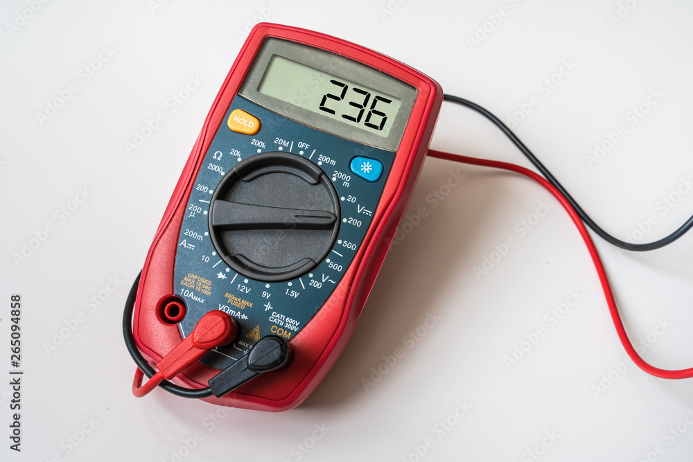 Red digital multimeter - isolated on white background Red digital multimeter - isolated on white background
