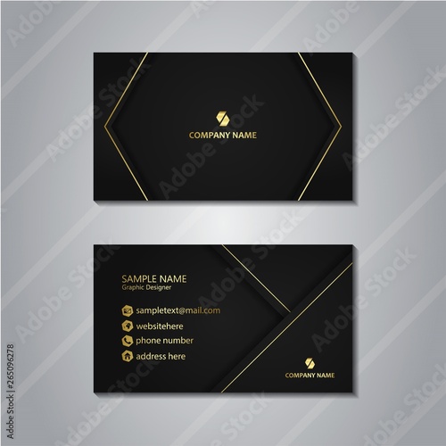 black business card with gold accent