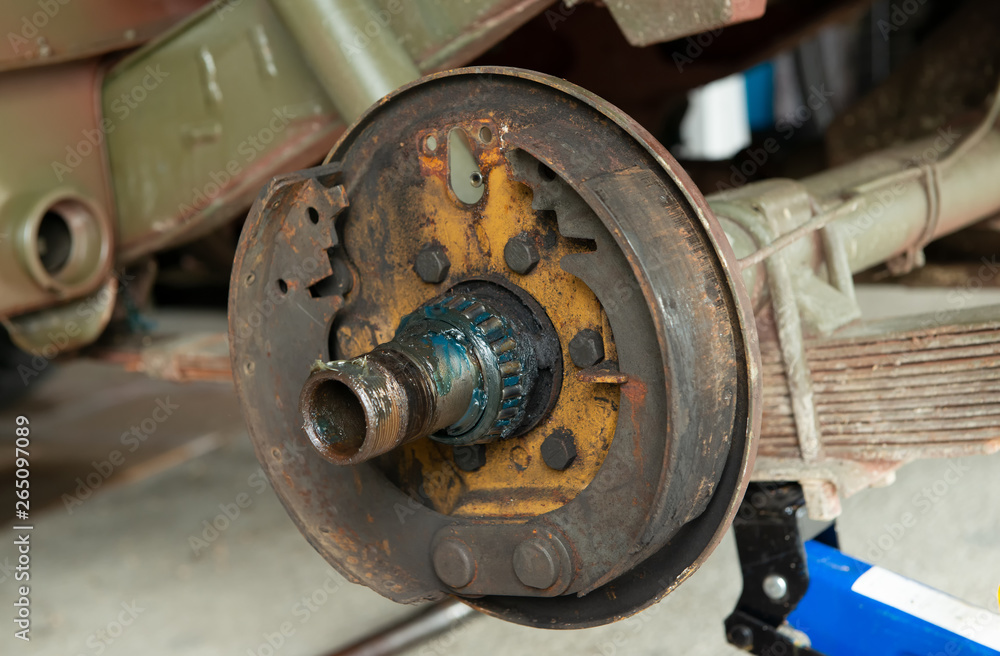 Rusty drum brake, A drum brake jeep disassembled in a garage Rusty drum brake, A drum brake jeep disassembled in a garage