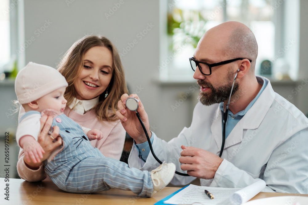 Mother with baby visiting pediatrician