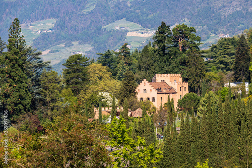 Panorama of Castle Pienzenau between a green landscape of Meran. Merano, Province Bolzano, South Tyrol, Italy. photo