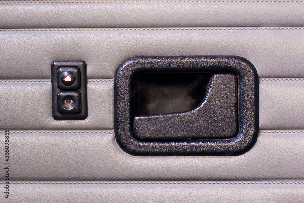 Door handle and window buttons in a retro car Door handle and window buttons in a retro car